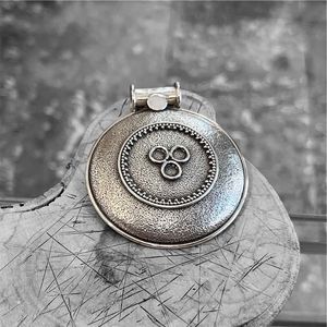 2. Round pendant “Trinity” silver gray
