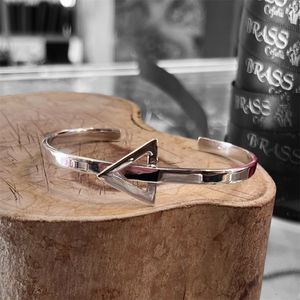 2. Rigid “triangle” bracelet silver gray