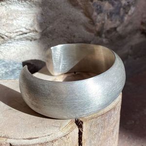 2. Rigid domed bracelet silver gray